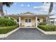 Inviting community clubhouse with covered entrance at 857 Cambridge Ct, Dunedin, FL 34698