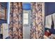 Bright bathroom with shower and floral curtains at 857 Cambridge Ct, Dunedin, FL 34698