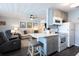 Open concept kitchen with island and grey cabinets at 650 Pinellas Point S Dr # 211, St Petersburg, FL 33705