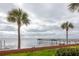 Scenic waterfront view with a pier and calm water at 650 Pinellas Point S Dr # 211, St Petersburg, FL 33705