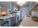 Modern kitchen with white appliances and grey cabinets at 650 Pinellas Point S Dr # 211, St Petersburg, FL 33705