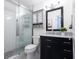 Updated bathroom with subway tile shower, dark vanity, and modern fixtures at 650 Pinellas Point S Dr # 211, St Petersburg, FL 33705