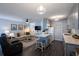Open concept living and kitchen with grey cabinets at 650 Pinellas Point S Dr # 211, St Petersburg, FL 33705