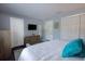 Bright bedroom with a dresser, closet and king size bed at 650 Pinellas Point S Dr # 211, St Petersburg, FL 33705