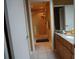 Bathroom with granite vanity, tiled floor, and shower at 13936 Clubhouse Cir # 13936, Tampa, FL 33618