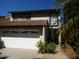 Two-story home with attached garage and landscaping at 13936 Clubhouse Cir # 13936, Tampa, FL 33618