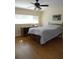 Bedroom with wood floors and a dresser at 13936 Clubhouse Cir # 13936, Tampa, FL 33618