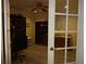 Home office with built-in shelving and hardwood floors at 13936 Clubhouse Cir # 13936, Tampa, FL 33618