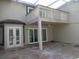 Elevated deck and back patio with sliding glass doors and tranquil setting at 13936 Clubhouse Cir # 13936, Tampa, FL 33618