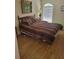 Bright bedroom with laminate wood floor and a double bed at 13936 Clubhouse Cir # 13936, Tampa, FL 33618