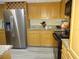 Modern kitchen with stainless steel appliances and wood cabinets at 13936 Clubhouse Cir # 13936, Tampa, FL 33618