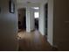 Bright hallway with light brown wood laminate flooring at 13936 Clubhouse Cir # 13936, Tampa, FL 33618