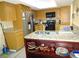 Kitchen boasts granite countertops and stainless steel appliances at 13936 Clubhouse Cir # 13936, Tampa, FL 33618