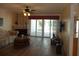Living room with fireplace, hardwood floors, and sliding glass doors to patio at 13936 Clubhouse Cir # 13936, Tampa, FL 33618