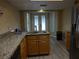 Kitchen with granite countertops and modern appliances at 13936 Clubhouse Cir # 13936, Tampa, FL 33618