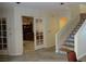 Elegant hallway with hardwood floors, leading to office and staircase at 13936 Clubhouse Cir # 13936, Tampa, FL 33618