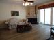 Living room with tiled floors, fireplace, and sliding doors to patio at 13936 Clubhouse Cir # 13936, Tampa, FL 33618