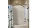 Bathroom with tub, shower, and updated fixtures at 253 Ashley Ct, Dunedin, FL 34698