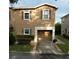 Two-story townhome with attached garage at 253 Ashley Ct, Dunedin, FL 34698