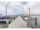White community dock with string lights leading to the water at 176 Philadelphia Lot 5 Blvd, Palm Harbor, FL 34684