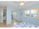 Bedroom with mirrored closet doors and light blue walls at 176 Philadelphia Lot 5 Blvd, Palm Harbor, FL 34684