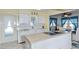 White kitchen with island, built-in microwave, and breakfast nook at 176 Philadelphia Lot 5 Blvd, Palm Harbor, FL 34684