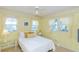 Cozy bedroom with a queen-size bed and yellow walls at 176 Philadelphia Lot 5 Blvd, Palm Harbor, FL 34684