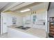 Bright kitchen with white cabinets, island, and modern appliances at 176 Philadelphia Lot 5 Blvd, Palm Harbor, FL 34684