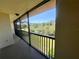 Enjoy the serene outdoors from this screened balcony with a beautiful view of lush greenery at 1662 Seascape Cir # 205, Tarpon Springs, FL 34689