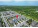 Scenic aerial view of the neighborhood with lush greenery and distant water views at 707 Winterside Dr, Apollo Beach, FL 33572