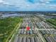 Wide aerial perspective of the neighborhood, highlighting proximity to water and commercial area at 707 Winterside Dr, Apollo Beach, FL 33572