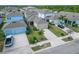Home exterior featuring a well-kept lawn, a wide driveway, and a two-car garage at 707 Winterside Dr, Apollo Beach, FL 33572