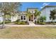 Charming two-story home with landscaped front yard and welcoming front porch at 707 Winterside Dr, Apollo Beach, FL 33572