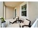 Relaxing front porch with cozy seating, creating a welcoming and comfortable outdoor space at 707 Winterside Dr, Apollo Beach, FL 33572
