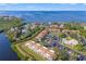 Aerial view of condo complex with pool and canal access at 1662 Seascape Cir # 205, Tarpon Springs, FL 34689