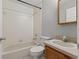 Clean bathroom with a tub, toilet and vanity at 1662 Seascape Cir # 205, Tarpon Springs, FL 34689