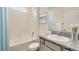 Bathroom with granite countertop, tub, and shower at 916 160Th E Ln, Bradenton, FL 34212