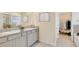 Double vanity bathroom with walk-in closet access at 916 160Th E Ln, Bradenton, FL 34212