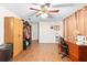 Spacious home office with wood floors, ceiling fan, and large closet at 5621 Moog Rd, New Port Richey, FL 34652