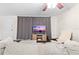 Cozy living room featuring a comfortable couch and large TV at 5621 Moog Rd, New Port Richey, FL 34652