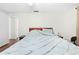 Bright bedroom with double bed and wood flooring at 5621 Moog Rd, New Port Richey, FL 34652