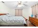 Spacious bedroom with a double bed and dresser at 5621 Moog Rd, New Port Richey, FL 34652