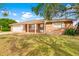 House exterior showcasing a ranch style home with a covered porch at 5621 Moog Rd, New Port Richey, FL 34652