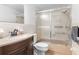 Clean bathroom with a shower/tub combo and updated vanity at 5621 Moog Rd, New Port Richey, FL 34652