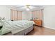 Bedroom with double bed, wood floors, and curtains at 5621 Moog Rd, New Port Richey, FL 34652