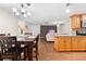 Dining area with a wood table and chairs, open to the kitchen and living room at 5621 Moog Rd, New Port Richey, FL 34652