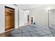 Bedroom with cedar closet and gray bedding at 5621 Moog Rd, New Port Richey, FL 34652