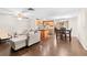 Living room with sectional sofa and open kitchen view at 5621 Moog Rd, New Port Richey, FL 34652