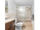 Clean bathroom with shower/tub combo and updated vanity at 5621 Moog Rd, New Port Richey, FL 34652
