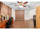 Bright home office features wood flooring, built-in desk, and ample natural light at 5621 Moog Rd, New Port Richey, FL 34652